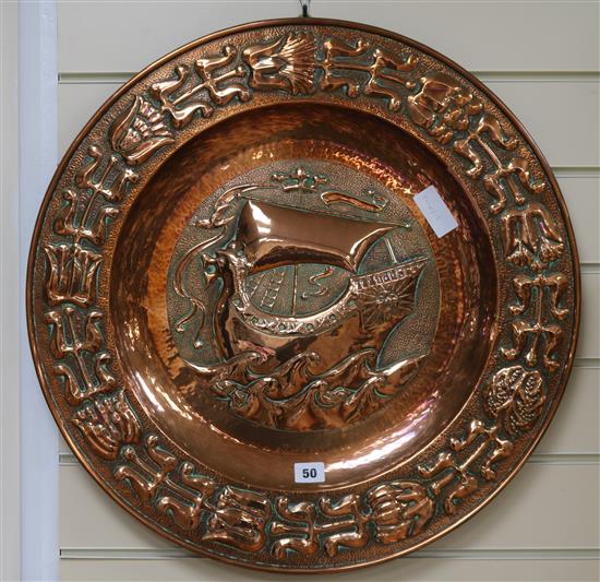 A Newlyn style embossed copper charger